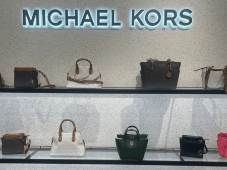 Michael Kors Bags on display shelves in store
