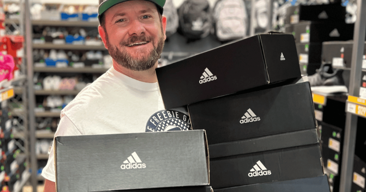 Kendall Holding Adidas boxes in shoe store